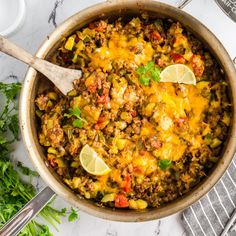 a pot filled with mexican food and garnished with cilantro