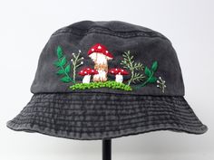 Item: mushroom embroidered bucket hat Material: 100% cotton Size: one size fits most Embroidery: hand made with acrylic thread Free first class shipping, upgradable priority mail service. 30 days return policy, feel confident at your purchase! Embroidered Adjustable Bucket Hat, Handmade Cotton Hats For Outdoor, Handmade Cotton Outdoor Hats, Adjustable Embroidered Bucket Hat, Whimsical Cotton Cap, Handmade Outdoor Bucket Hat, Novelty Outdoor Bucket Hat, Embroidered Curved Brim Hat For Outdoor, Outdoor Embroidered Hat With Curved Brim