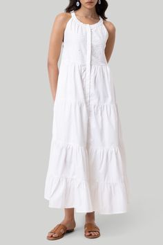 Look effortlessly elegant with our Reistor Embroidrered Tiered Maxi Dress. This pristine white dress is crafted with organic cotton which makes it such a comfy, versatile piece. This sleeveless dress has intricate cutwork embroidery on its yoke, and is the perfect blend of style and practicality. With conveniently placed pockets and a series of tiers, this dress offers both charm and comfort, making it a forever favorite! Wash in cold water or dry clean only Do not soak bleach or wring Line dry White Cotton Maxi Dress With Broderie Anglaise, Cotton Broderie Anglaise Maxi Dress, White Broderie Anglaise Sleeveless Maxi Dress, White Sleeveless Broderie Anglaise Maxi Dress, White Sleeveless Maxi Dress With Broderie Anglaise, Cotton Maxi Dress With Broderie Anglaise For Daywear, White Cotton Dress With Broderie Anglaise, Elegant White Cotton Maxi Dress, Cutwork Embroidery