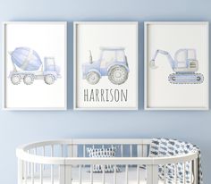 a baby's room with blue walls and pictures on the wall, including a crib