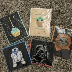 four star wars themed birthday cards on the ground