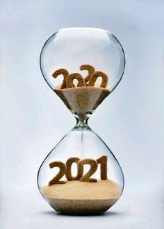 an hourglass with sand in it and the numbers 2012 written on it, as if they were made out of sand