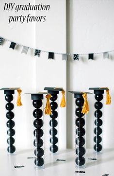 black and white graduation decorations with orange tassels