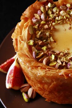 a pastry with nuts and cheese on top