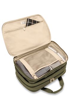 Bring all you need and have room for more with this expandable carry-on bag that allows for 4 more inches of packing space when you need it.Closure: The zip-around closure features self-repairing YKK RC zippers with lockable double pulls.Exterior: The durable ballistic-nylon exterior resists wear, moisture, dirt and abrasion. A slip-through back panel allows the bag to slide through the handle of a roller bag for transporting two bags as one. Plus, signature SpeedThru™ and Outsider® pockets offe Affordable Rectangular Travel Bag With Zipper Pouch, Affordable Multifunctional Travel Bag With Zipper Pocket, Affordable Foldable Travel Bags, Cheap Everyday Use Packable Travel Accessories, Cheap Casual Travel Bag With Removable Pouch, Cheap Travel Bag With Zipper Closure, Affordable Luggage With Laptop Compartment For Overnight Trips, Cheap Large Capacity Travel Bag, Cheap Everyday Packable Travel Accessories