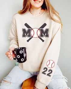 This cute Baseball Mom sweatshirt is fun to customize with your team colors and kids' names on the sleeve. It's perfect for those chilly spring days at practice and games. Printed on high-quality Gildan sweatshirts with water-based inks, it'll last season after season! ⭐Details: ✨ Gildan 18000 ✨ Classic fit ✨ Runs true to size ✨ Medium-heavy fabric ✨ Tear-away label ✨ 50% cotton, 50% polyester ⭐Care: Machine cold inside out (max 40C or 105F); Tumble dry: low heat; Do not dry-clean. ⭐Current Prod Baseball Gear, Mom Sweater, Team Mom, Personalized Baseballs, Kids Names, Gildan Sweatshirts, Sports Mom, Change Of Address, Mom Sweatshirt