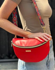 Add a touch of glam to your outfit with this handcrafted red bum bag. Made with a gorgeous faux leather fabric with a supple, soft finish.  Medium sized, fully lined and an internal zipper pocket, adjustable strap in the same fabric and as an added bonus there's a free patterned adjustable strap. Measurements: 10.25" L x 4" W x 6.75" H 26cm L x 10cm W x 17cm H Wipe clean with a damp cloth  *READY TO SHIP* made from a Unikatz pattern Sling Bag Outfit, Leather Bum Bag, Faux Leather Fabric, Bum Bag, Leather Fabric, Sling Bag, Cloth Bags, Bright Red, Fanny Pack