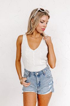 You are sure to have the biggest smile on your face when you complete your look with this adorable ivory colored top featuring lightweight and soft knit material, a v-cut neckline and upper back, 1-inch shoulder straps, and a flattering silhouette that ends in a straight ribbed hemline! Measurements S : Bust 28", Length 17.5", Waist 26". M : Bust 30", Length 18", Waist 28". L : Bust 32", Length 18.5", Waist 30". White Knit V-neck Tank Top, White V-neck Knit Tank Top, Chic Cream Knit Tank Top, Chic White Knit Tank Top, Fitted Cream V-neck Sweater Vest, Kids Athleisure, Concert Fashion, Fashion Shoes Sneakers, Long Sweater Dress