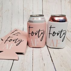 three pink and white can coolers with the words forty forty af on them