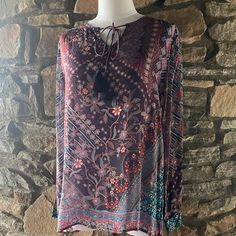 Soft, Fluid Multi-Colored Floral Print Tunic With Long Tasseled Ties At Neck. 100% Viscose Silk. Hand Wash. Do Not Dry Clean. Bohemian Multicolor Tops With Tassels, Red Tassel Tops For Beach, Multicolor Bohemian Tops With Tassels, Casual Red Tops With Tassels, Multicolor Bohemian Top With Tassels, Multicolor Bohemian Blouse With Tassels, Red Tassel Beach Tops, Bohemian Multicolor Tassel Blouse, Casual Red Tassel Top