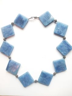 Beautiful Blue Crystal Square Shaped Stone Link Geometric Style Chain Statement Necklace Light Blue Single Strand Jewelry For Jewelry Making, Blue Costume Jewelry Necklaces With Lobster Clasp, Blue Rectangular Faceted Jewelry, Blue Beaded Necklaces With Lobster Clasp For Jewelry Making, Blue Beaded Necklaces For Jewelry Making, Blue Beaded Rectangular Jewelry, Blue Rectangular Beaded Jewelry, Bohemian Blue Rectangular Necklace, Blue Round Bead Necklace With Lobster Clasp