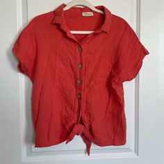 Just Living Coral Medium Tie Front Blouse With Buttons. Short Sleeve. Smoke Free Home. Never Worn. Red Summer Shirt For Daywear, Red Summer Daywear Shirt, Summer Red Blouse For Daywear, Red Summer Blouse For Daywear, Red Shirt For Summer Daywear, Red Blouse For Summer Daywear, Red Button-up Summer Top, Red Button-up Top For Summer, Red Button-up Blouse For Vacation