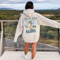 Indulge in the ultimate comfort with a Hawaii surf hoodie, perfect for the trendy woman embracing the VSCO aesthetic. This oversized summer sweatshirt embodies the coconut girl aesthetic, making it a must-have beach essential for those seeking a stylish and cozy pullover. ABOUT THE HOODIE Gildan 18500 50% cotton, 50% polyester Medium-heavy fabric  Classic fit Tear-away label Runs true to size Size UP 1-2 Sizes for oversized fit SHIPPING AND PROCESSING All orders are processed and shipped within Oversized Long Sleeve Vsco Hoodie, Casual Long Sleeve Hoodie For Vacation, Long Sleeve Hoodie For Beach In Fall, Vacation Hoodie With Relaxed Fit And Long Sleeves, Relaxed Fit Long Sleeve Hoodie For Vacation, Casual Hoodie For Beach In Fall, Casual Beach Hoodie For Fall, Casual Vacation Hoodie With Letter Print, Casual Fall Beach Hoodie