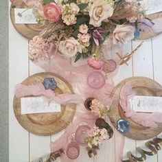 a table with plates and flowers on it