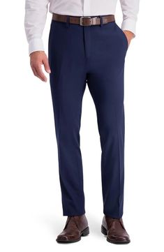 This flat front slim fit pant features a hook and bar closure, and fly front. The off seam pocket design and single welt button through back pockets is what gives this pant a sophisticated look. The Elastane fibers allow for the best comfort while maintaining a great recovery so your pants looks great at the end of the day..14' length leg opening.Zipper fly.Belt loops.5-pocket design.Straight leg.Solid.Woven.64% polyester, 34% viscose, 2 elastane.Machine wash, line dry.Imported.Model stats: 6'1' Flat Front Bottoms With Welt Pockets In Suiting Fabric, Formal Straight Dress Pants With Button Closure, Tailored Business Bottoms With Button Closure, Elegant Pants With Button Closure And Straight Hem, Fitted Straight Leg Dress Pants With Button Closure, Tailored Formal Bottoms With Button Closure, Fitted Business Bottoms With Button Closure, Fitted Bottoms With Button Closure And Straight Hem, Fitted Bottoms With Button Closure For Business