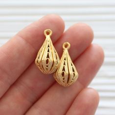 Filigree charms, chandelier earrings dangle, filigree earrings findings, gold filigree charms, necklace charms, filigree teardrop charms L: 24 mm W: 12 mm Please choose the quantity you want! Also available in silver. More charms and beads? Please click the link below: https://www.etsy.com/shop/EastVillageSupply/items?ref=l2-shopheader-name&section_id=18473488 Would you like to see more filigree findings? https://www.etsy.com/shop/EastVillageSupply?ref=l2-shopheader-name&search_query=fil Necklace Charms, Charms Necklace, Filigree Earrings, Gold Filigree, Earring Findings, Earrings Dangle, Chandelier Earrings, Charm Necklace, Dangle Drop Earrings