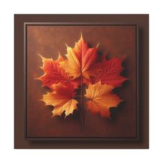 three autumn leaves are arranged in a square frame on a brown background, with the colors of orange and yellow