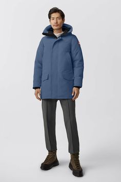 The Langford gets an update with streamlined hood adjustment, additional drop-in pockets, and added backpack straps. This stylish urban piece is similar to the Chateau parka but is slightly longer for greater leg protection. With a storm flap over the centre front zipper and two interior pockets, Langford offers clean lines and a modern look - all in an uncompromisingly protective parka. Customize your parka and extend the coverage of your hood with a variety of our interchangeable Hood Trim acc Men Parka, Baby Outerwear, Mens Parka, Great Legs, Snow Pants, Backpack Straps, Boots And Sneakers, A Storm, Mens Outerwear