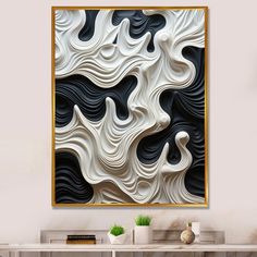 an abstract art piece hanging on the wall above a white table with two vases