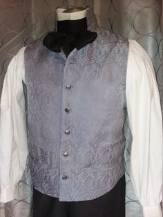 This item is made-to-order and will ship within 14 days of purchase Classic English Regency mans waistcoat with a high standing collar, 7 buttons , 2 functioning pockets at waist, back belt with eyelet lacing, and is fully lined. Pair it with an English Regency Shirt in white cotton, for that perfect Mr. Darcy look! Click here for more info on the shirt: https://www.etsy.com/listing/86516151/mans-english-regency-and-18th-century? Color and fabric selections vary upon availability - please specif Steampunk Formal Sleeveless Vest, Formal Steampunk Sleeveless Vest, Formal Sleeveless Steampunk Vest, Gothic Fitted Vest With Buttons, Fitted Wedding Vest With Buttons, Fitted Vest With Buttons For Wedding, Elegant Wedding Vest With Buttons, Steampunk Fitted Vest With Buttons, Fitted Nehru Jacket With Stand Collar