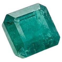 an emerald stone on a white background