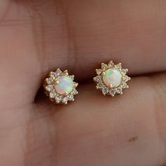 Super cute opal stud earrings featuring a pavé halo! Looks stunning as a first or second hole piercing.  - - -  D E T A I L S - - -  * Made of 925 Sterling Silver * We use a THICK plating of 14k Gold or Rhodium * Nickel-free & Hypoallergenic (safe for sensitive ears!) * Sold as a pair  * 7mm Diameter * Push-back closure ✻ Earrings on Model ✻ Bezel Opal Studs --> https://www.etsy.com/listing/692672584/opal-stud-earrings-small-studs?click_key=46e17fce4fac05d0b89f4ca34b25042ca6b6303e%3A692672584&click_sum=ac9c35dd&ga_search_query=opal%2Bstuds&ref=shop_items_search_4&pro=1&frs=1&sts=1 Tiny Opal Studs --> https://www.etsy.com/listing/869783588/opal-earrings-tiny-opal-stud-earrings?click_key=fed4aa04fafb46df9f585b2681d142b8076bf172%3A869783588&click_sum=3fd9b6ca&ga_search_query=opal%2Bstuds&ref= Opal Earrings For Wedding, Dainty Opal Earrings For Wedding, Opal Earrings For Anniversary - Fine Jewelry, Fine Jewelry Opal Earrings For Anniversary, Opal Gemstone Earrings For Anniversary, Opal Jewelry With Matching Earrings For Wedding, Anniversary Opal Earrings Fine Jewelry, Bridesmaid Earrings Gift, Opal Stud Earrings