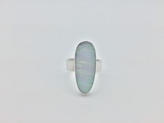 Hi everyone, just wanted to let you know we are open and shipping daily. White Fire Opal Ring Set in 925 Sterling Silver // Size 10 Length: 28 mm Weight: 7.2 grams Stone: lab created opal Origin: Japan Hallmark 925 This fire opal has been cultured in Japan over a three year period and contains the same chemical composition as natural opal. Silver Opal Ring With Polished Finish, Modern Sterling Silver Opal Ring, Modern Sterling Silver Oval Opal Ring, Oval Opal Ring Stamped 925, White Opal Ring, Larimar Rings, Fire Opal Ring, Opal Ring, Natural Opal