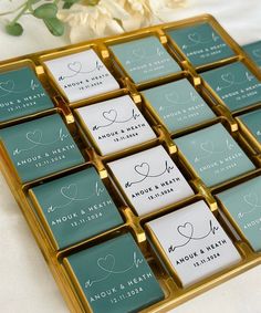 wedding favors in gold and teal with hearts on them