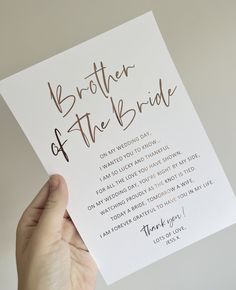 a person holding up a card with the words brother of the bride written on it