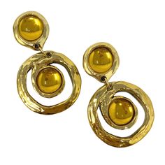 Gorgeous vintage statement earrings! Gold and yellow resin Lightweight Clip ons Circa 1980s  New old stock Never worn  Measure 3 5/8" long & 2 1/4" wide  Great vintage condition. Please enjoy!  Thanks for visiting ♥ Retro Yellow Earrings For Party, Retro Gold Dangle Earrings, Retro Yellow Party Earrings, Vintage Yellow Metal Jewelry, Yellow Retro Party Earrings, Retro Gold Drop Clip-on Earrings, Retro Yellow Dangle Jewelry, Vintage Yellow Dangle Jewelry, Retro Gold Dangle Clip-on Earrings