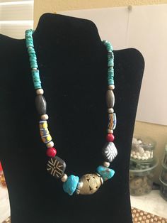 ** PLEASE READ EVERYTHING BEFORE YOU PURCHASE ** Hand made  pretty  NECKLACE with multiple vintage beads such as Kingman turquoise, African trade beads, agate beads, coral beads, silver beads, Asian wood beads, and other kind of turquoise beads. With an unique by my self I believe it is a nice gift for yourself or for your loved ones. . . . . . . . . . . . . . . . . . . . . . . . . . . . . . . . . . . . . . . . . . .. . . . . . . . . . . . .  -- size of the necklace: 19.4 inches long -- size of the  beads: the biggest one is the African Brass bead, 3 cm X 2 cm; -- size of the 2 big Kingman turquoise beads: 2 cm X 1.3 cm  -- size of the 2 wood beads: 2cm X 2 cm; -- weight of the necklace: 2.76 oz For getting the 50% discount,Please send me a message before order and I will change the price Vintage Beaded Turquoise Necklace With Round Beads, Vintage Turquoise Jewelry With Colorful Beads, Vintage Beaded Necklace With Gemstone Beads For Festival, Vintage Turquoise Necklace With Round Gemstone Beads, Vintage Beaded Necklaces With Gemstone Beads For Festivals, Vintage Turquoise Necklace With Round Beads, Vintage Gemstone Beaded Necklaces For Festivals, Vintage Turquoise Necklace With Round Natural Stones, Bohemian Turquoise Necklace With Colorful Round Beads