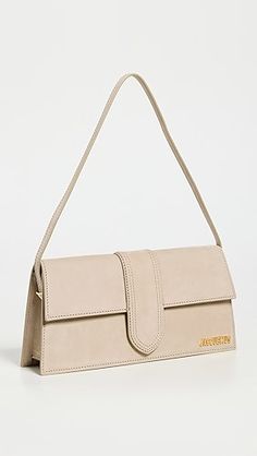 Jacquemus Le Bambino Long Bag | Shopbop Designer Suede Shoulder Bag For Formal Occasions, Classic Formal Suede Shoulder Bag, Elegant Formal Suede Shoulder Bag, Classic Suede Shoulder Bag With Palladium Hardware, Luxury Bags With Snap Closure, Luxury Suede Shoulder Bag For Formal Occasions, Elegant Suede Business Shoulder Bag, Classic Suede Bags For Formal Occasions, Chic Suede Shoulder Bag With Magnetic Closure