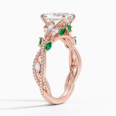 a rose gold engagement ring with an intricate design and round diamonds on the band, set in