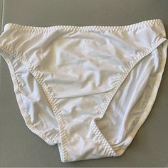 Pack Of 10 White Bikini Panties | Nwt Style: 5051 Description: Bikini Color: White Size: Large And Medium Material: 75% Antron And 25% Spandex Smoke And Pet Free Home White Stretch Bottoms For Pool, White Stretch Swim Trunks For Beachwear, White Brief Swim Trunks For Beach, White Stretch Swimming Bottoms, White Fitted Swim Trunks For The Beach, White Brief Bottoms For Poolside, White Stretch Brief Swimwear, White Beach Bottoms In Brief Style, White Beach Brief Bottoms