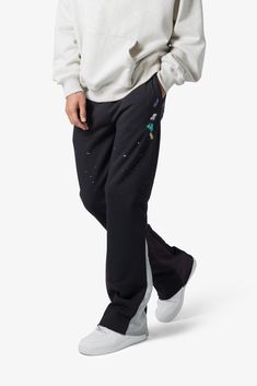 the Contrast Bootcut Sweatpants are designed with a relaxed fit throughout, featuring an elasticized self waist and leg opening, multi-colored paint splatter throughout, and finished with denim and contrasting panels at the inseam and outseam to provide a flare at the leg opening. details relaxed fit flared leg opening 55% cotton 45% polyester model is 6’1, 140 lbs and wears a size medium Bootcut Sweatpants, Layered Hoodie, 140 Lbs, Fuzzy Cardigan, Baggy Trousers, Denim Patches, Denim Flares, Paint Splatter, Black Coat