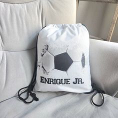 This custom drawstring bag makes a great gift for any birthday boy who loves baseball, basketball or soccer.  ☑️Great for Gift for boys, soccer team, end of season, sleepover party, swag bag,  ☑️Hold water bottle, extra pair of clothes, cleats, shin guards, gloves ☑️Party Favor Bags and Souvenir for the Guests How to Order  1) Choose your type of Bag 2) Choose your Image/Ball (Split Soccer Ball, Watercolor Soccer Ball, Basketball, or Baseball) ➡️Text Box: 3) Enter the Text EXACTLY as you want it ➡️Bags available: D for Drawstring Bags, T for Totes, B for Backpacks ➡️Color & Size:  Please see listing colors 💥NOTE:   There will be some patches of sequins that are discolored due to when it is pressed. Color will vary slightly due to screen color.  🏡HOME PAGE OF MY SHOP: www.RejoiceInCreatio Customizable White Bags For Sports Events, White Letter Print Sports Bag, White Sporty Bag As Gift, Sporty White Bag Suitable For Gifts, Sporty White Bag As Gift, Personalized Sporty Bags For Sports Events, Sporty Personalized Bag For Sports Events, White Casual Drawstring Bag For School, Casual White Drawstring Bag For School