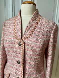 Beautiful French vintage jacket, in a pale pink, very elegant. , made with a woven fabric of pink, beige and grey Hand Made by a French tailor very nice shape, especially with its collars It Sizes for French  medium Size, but please see measures in the listing mannequin is a 38 French size, it fits, with possibility to put a sweater under lighty curved, not too much under the arms, lying flat : 19 waist 18,5  total length 26 on the grey lining, please note a discoloration on armpit, due to deodo Elegant Pink Tweed Outerwear, Pink Fitted Tweed Jacket For Formal Occasions, Fitted Pink Tweed Jacket For Formal Occasions, Pink Single-breasted Tweed Jacket, Formal Pink Tweed Blazer, Elegant Pink Long Sleeve Tweed Jacket, Elegant Pink Tweed Jacket For Work, Chic Pink Tweed Jacket For Formal Occasions, Pink Fitted Tweed Jacket For Spring