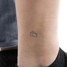 a person with a small tattoo on their ankle