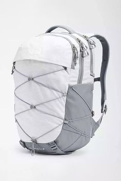 Great for class or traveling, this The North Face Borealis Backpack for Women in White has simplified organization, many compartments and has a stand up design. This backpack is everything you need and more! Features: The North Face Style: NF0A52SI-EP4 Color: Metallic White The North Face backpacks Articulated shoulder straps and rounded back panel Large main compartment Front fleece-lined pocket for sunglasses, phone or keys Front and side elastic bungee system Removable waist belt, with stand- Notion Board, North Face Brand, Stitch Lines