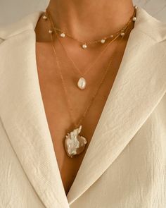 Minimalist design with a statement. This stunning choker is handcrafted with handpicked tiny freshwater pearls and 14K gold-filled materials, making it long-lasting and perfect for sensitive skins. Each pearl is unique and slightly varies in size and shape — and that's the beauty of it. …………………………………. I T E M D E T A I L S • Genuine freshwater pearls measure 4 mm • Comes with 2-inch extender chain for a perfect fit • 14K Gold Filled Chic Adjustable Pearl Necklace, Chic Handmade Choker As Gift, Chic Handmade Choker For Gift, Chic White Necklaces For Layering, Chic White Choker Jewelry, Chic White Layered Necklace, Chic White Layering Necklaces, Trendy Pearl Charm Choker As Gift, Elegant White Layered Choker Necklace