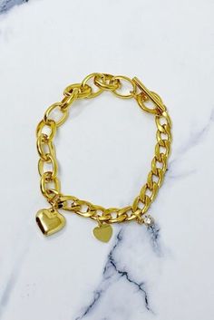 "The perfect mix of edgy and chic! This toggle closure duo link chain bracelet is detailed with three beautiful charms. So unique with two different chain mix.  Dimensions: 7.8\" x 0.5\" x 0.3\" 18k Gold plated Stainless Steel that last long with no tarnish Lead and Nickel Free Made in China Made In: China Material Composition: 18k Gold plated Stainless Steel" Link Chain Bracelet, Everyday Gifts, Gold Charm Bracelet, Wallet Fashion, Heart Bracelet, Steel Jewelry, Stainless Steel Jewelry, Gold Charm, Hair Accessories Headbands