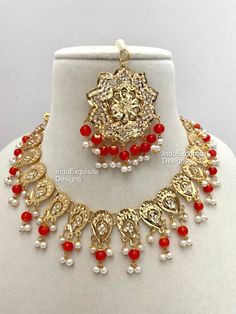 Jadau necklace set comes with Jhumka  Earrings and Tikka /Red/Punjabi Jadau Jewelry/Gold plated Jewelry  Bridal /Indian Wedding jewelry/bridal jewelry/ Indian jewelry /Kundan Jewelry/Kundan pearl choker/ Punjabi necklace/ Pakistani jewelry/High quality Indian Jewelry We kindly request to consider minor variations in colors, shades, textures as pictures displayed may slightly vary from the actual product due to digital image limitations. Please expect the possibility of some minor imperfections when buying handmade jewelry. Please contact us for any questions you might have. We will keep bringing the best quality jewelry for you. Thank you and happy shopping !! 😊 Orange Temple Jewelry For Gifts, Orange Temple Jewelry As A Gift, Orange Temple Jewelry Gift, Festival Kundan Necklace With Latkans, Round Kundan Necklace With Latkans For Festivals, Festive Orange Jewelry For Gift, Festive Orange Jewelry Gift, Chandbali Jewelry For Puja And Eid, Traditional Orange Jewelry For Celebration