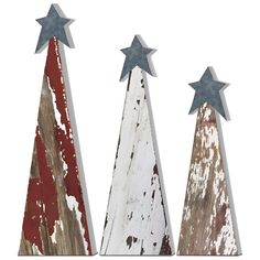 three wooden christmas trees with stars painted on the top one is red, white and blue