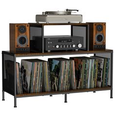 an old stereo system with record players and vinyls on it's shelf, in front of a white background