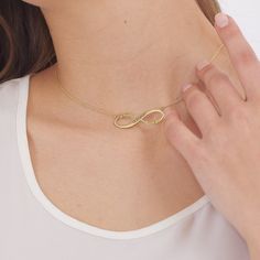 "Custom 14K Real Gold Infinity Name Necklace | Solid Gold Kids Infinity Name Jewelry | Dainty 18K Gold Necklace | Gift for Mom | Gift for Her Please send me a message to see how your necklace will look. We are going to design a MOCK-UP for you quickly, if requested. ► H O W * TO * O R D E R Step 1 : Choose the color and Material ( 8K ,14K , 18K , Gold, Rose Gold, White Gold ) Step 2 : Choose necklace length: 12\" to 24\" available Step 3 : Add your personalization: Simply use the 'PERSONALIZATION BOX' to let us know the NAME . ► DETAILS, MATERIAL & FINISH 8K , 14K , 18K Solid ( REAL ) Gold, Rose Gold, White Gold ALL COMPONENTS WILL COME AS SOLID REAL GOLD in the selected color such as yellow gold, rose gold or white gold. and carat such as 8K, 14K and 18K It comes with small gift box. All Infinity Necklace For Anniversary Gift, Gold Infinity Necklace For Anniversary Gift, Gold Infinity Necklace For Anniversary, Gold Infinity Necklace Fine Jewelry, Personalized Infinity Necklace Elegant Style, Elegant Personalized Infinity Necklaces, Gold Infinity Jewelry For Anniversary, Elegant Personalized Infinity Necklace, Yellow Gold Infinity Necklace For Wedding