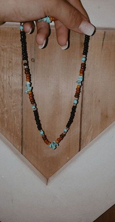 Casual Brown Beaded Necklaces With Colorful Beads, Brown Necklaces With Black Beads For Beach, Brown Jewelry With Black Beads For Festival, Festival Brown Jewelry With Black Beads, Adjustable Brown Necklace With Black Beads, Beach Necklaces With Colorful Beads In Brown, Black Bohemian Necklace As Gift, Black Necklaces With Colorful Beads For Beach, Brown Beaded Necklace With Black Beads As Gift