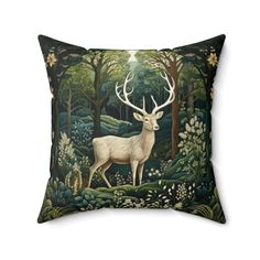 a pillow with an image of a deer in the woods