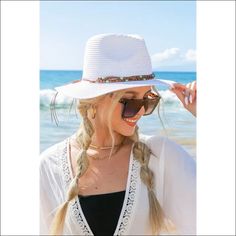 Beaded Belt Straw Panama HatDetailsBeaded or Embroidered Belt AccentSuede TieMaterial: 100% strawBrim length: 3.25" Style: Fedora hat Embellishment: Bead or Embroidered Belt Material Composition: 100% strawSuede Tie White Summer Hat Bands For Vacation, White Summer Hat Band For Beach, White Straw Hat Bands For Beach, White Woven Fedora For Summer, White Hat Bands For Summer Vacation, White Fedora For Beach Vacation, White Fedora For Beach Season Vacation, Beaded Fedora Sun Hat For Vacation, Casual Beaded Fedora Sun Hat