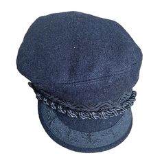 a blue hat with braids on the brim and side part of it's cap