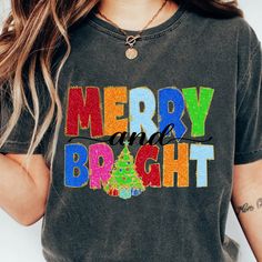 a woman wearing a merry and bright t - shirt